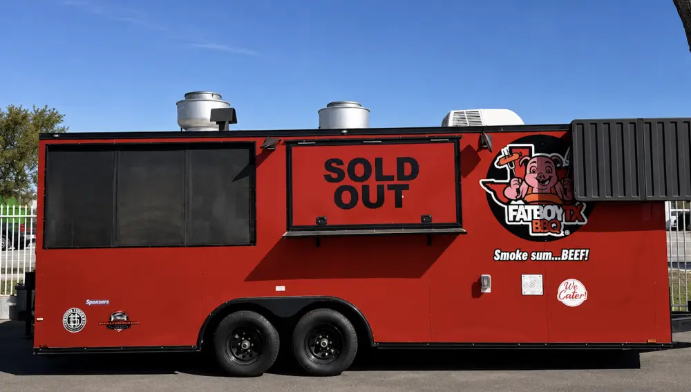 Fatboy TX BBQ food truck serving at a Houston catering event