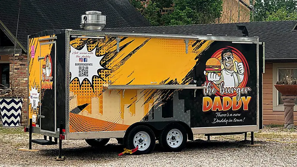 The Burger Daddy food truck serving at a Houston catering event